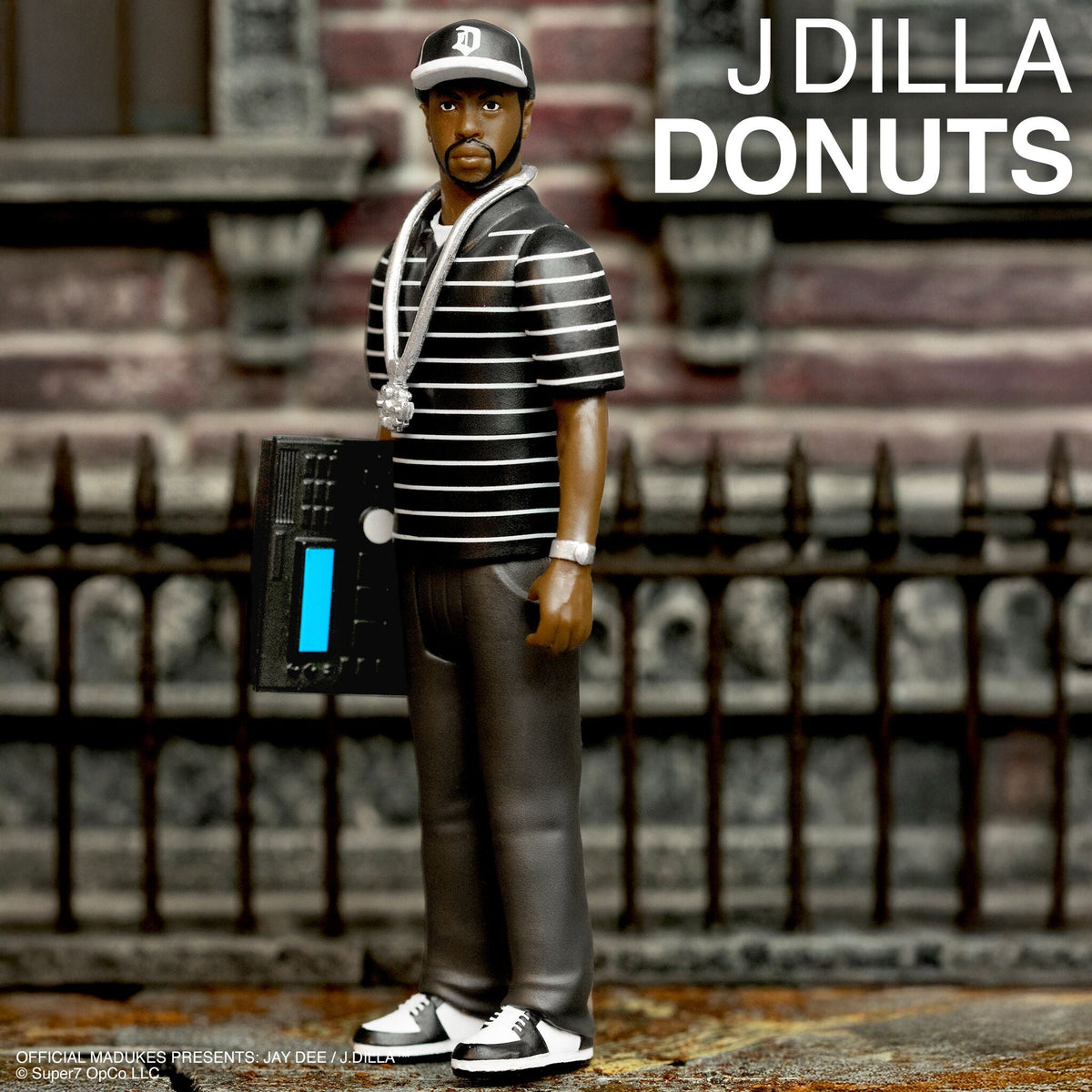 J Dilla ReAction Figures Wave 01 - J Dilla (Donuts - Smile Album Cover)